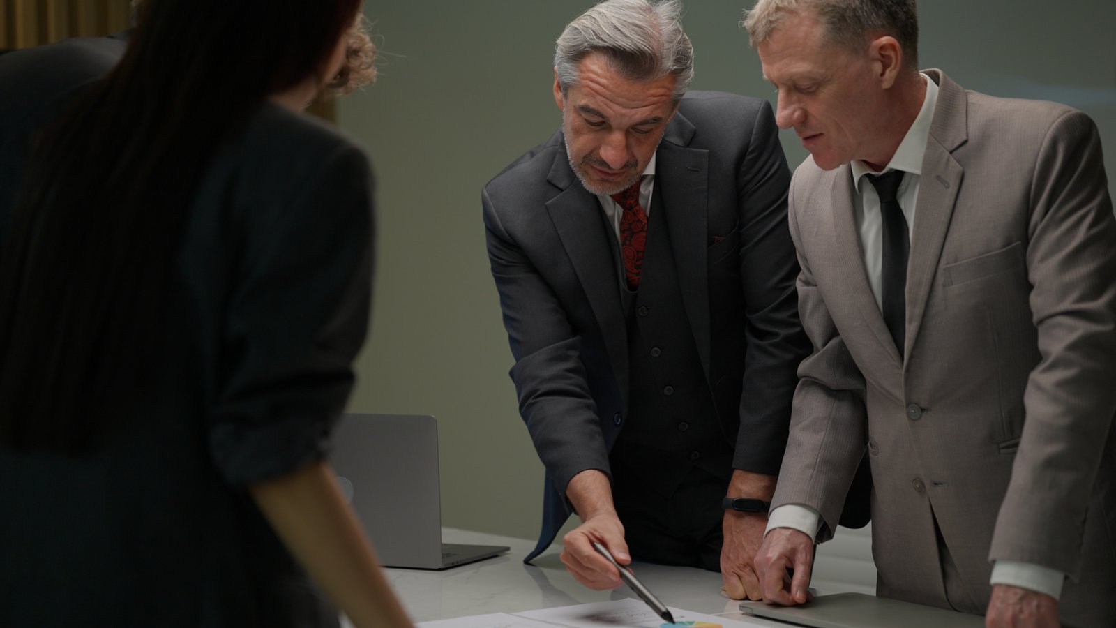 Business people discussing documents at a workplace
